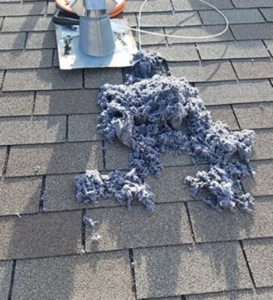 Dryer-vent-cleaning-lint-on-rooftop-dryer-vent