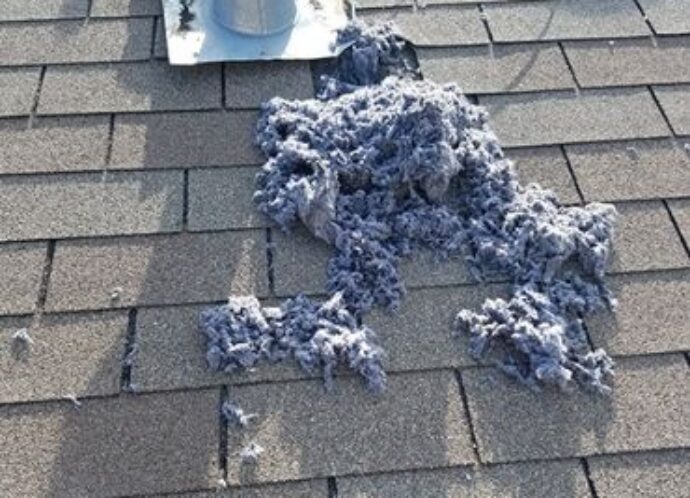 Dryer-vent-cleaning-lint-on-rooftop-dryer-vent